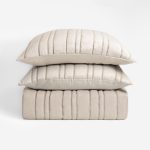 Amity home emery quilt in opal   vertical channel stitching