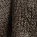 Amity home aurora quilt in tobacco   crinkled velvet texture