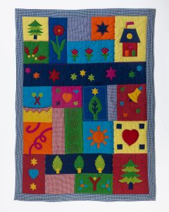 Amity home farmyard baby quilt in multi colored patchwork   appliquéd whimsical designs