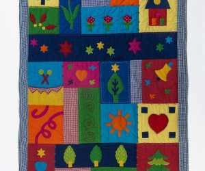 Amity home farmyard baby quilt in multi colored patchwork   appliquéd whimsical designs