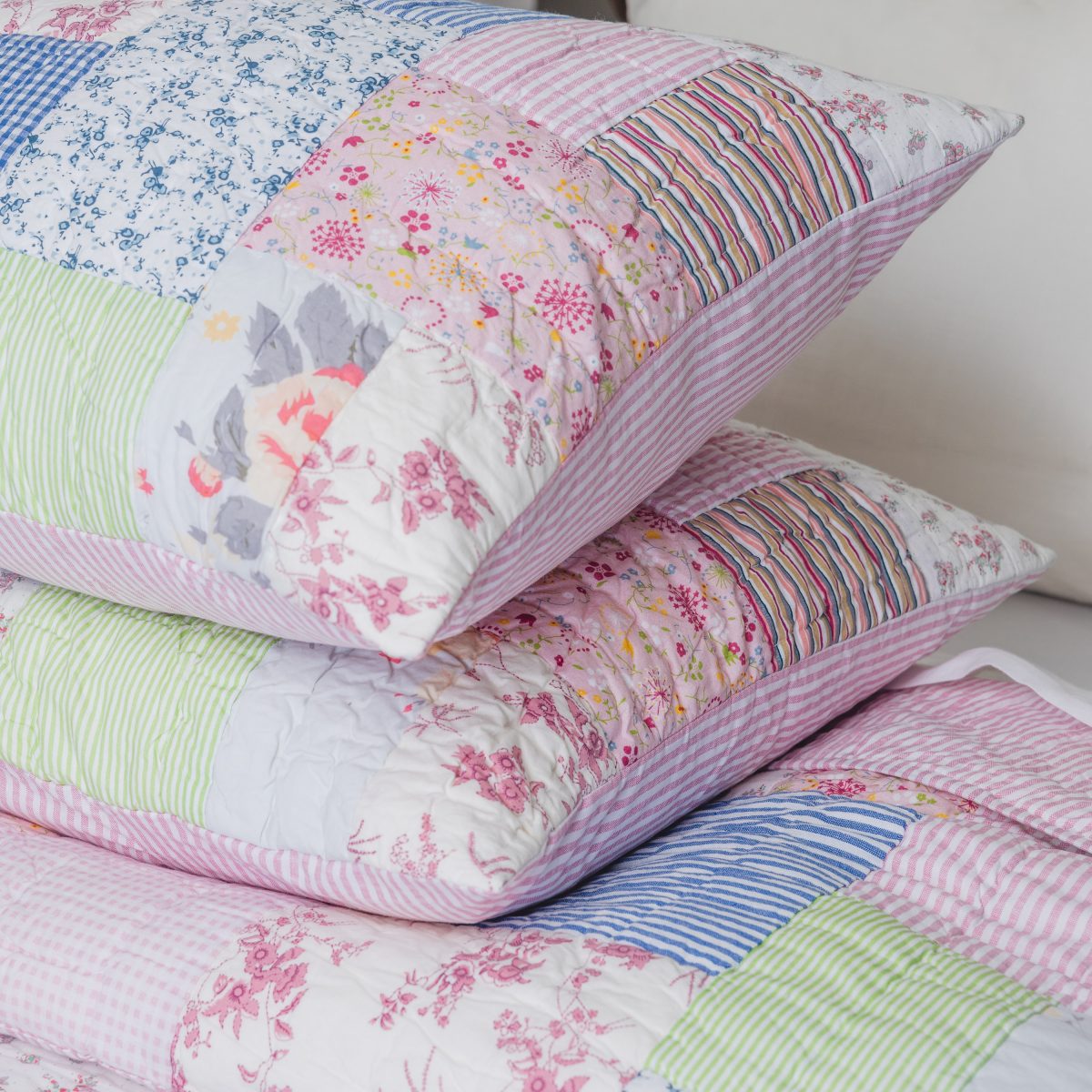 Amity home lattice patchwork quilt set   quilted pillows and quilt with floral striped and gingham patterns in pink blue and green