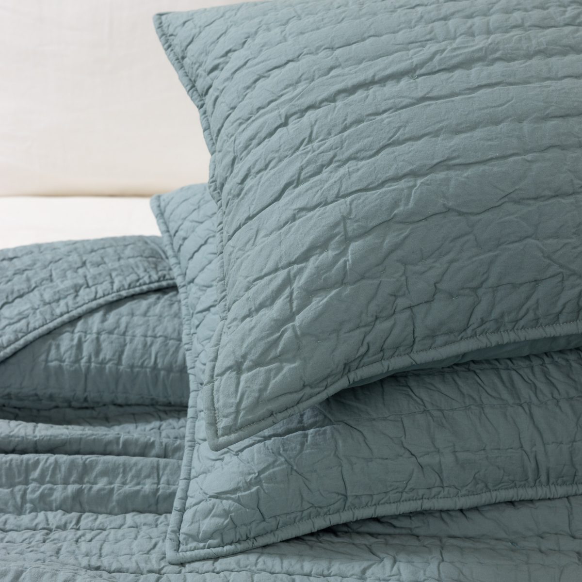 Amity home base camp quilt in mineral   crinkled channel stitch