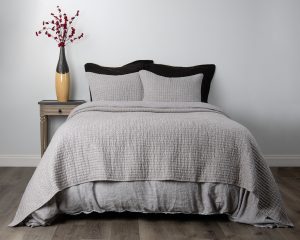 Amity home catalina linen quilt   grey chambray luxury linen quilt and shams with a textured crinkled pattern on a styled bed