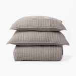 Amity home catalina linen quilt   grey chambray linen quilt and two matching pillows with a subtle quilted texture stacked