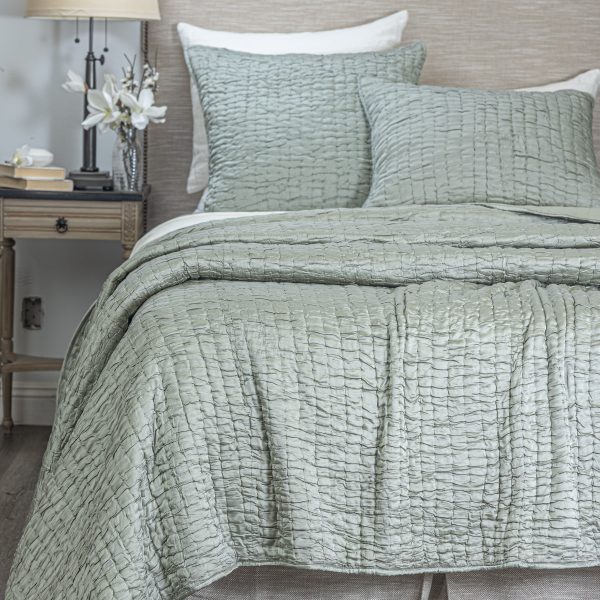 Amity Home Hadon Quilt - Seaglass quilt with a unique puckered texture and matching shams on a luxury bed.