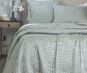 Amity home hadon quilt   seaglass quilt with a unique puckered texture and matching shams on a luxury bed