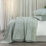 Amity home hadon quilt   seaglass luxury quilt with a unique puckered crinkled texture and matching pillows on a styled bed
