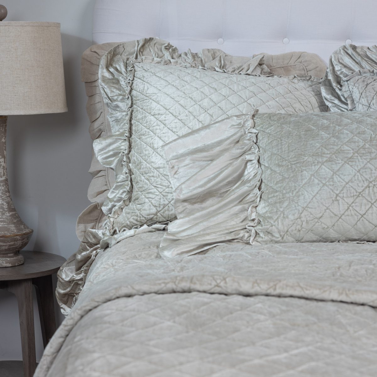 Amity home estrella quilt   oyster diamond quilted luxury bedding with ruffled shams on a styled bed