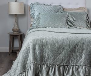 Amity home estrella quilt   sea glass crushed velvet quilt with diamond quilting and ruffled edges on a styled bed