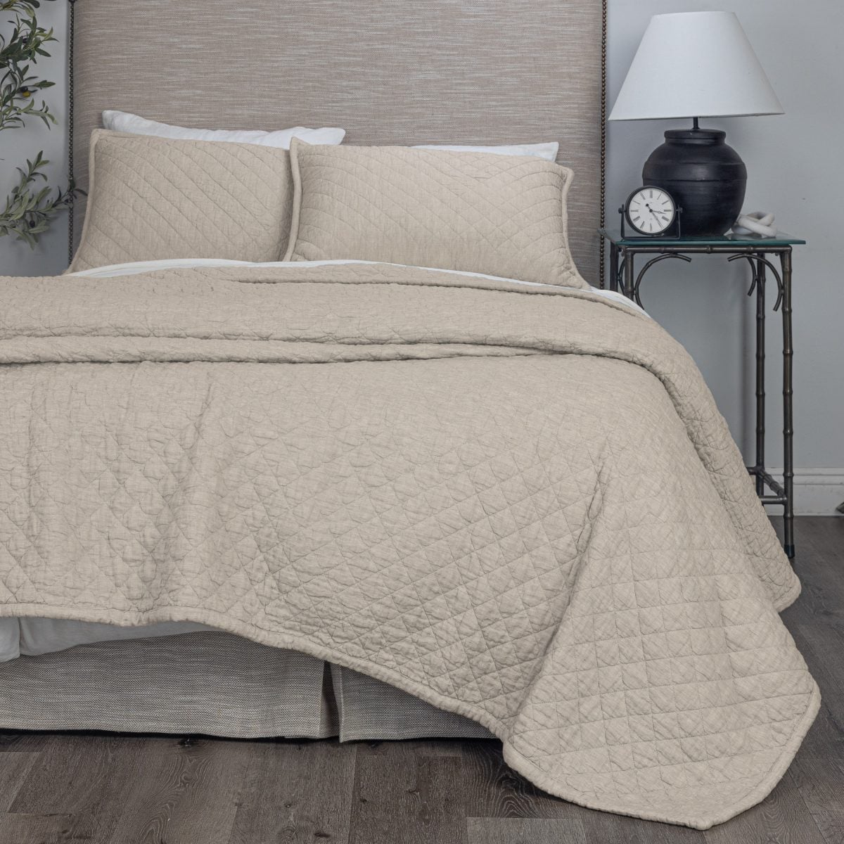 Amity home natural linen quilt with soft crinkled diamond quilting and matching pillows on a styled bed
