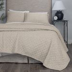 Amity home natural linen quilt with soft crinkled diamond quilting and matching pillows on a styled bed