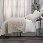 Amity home dale linen quilt in natural with diamond quilting and matching shams on a styled bed