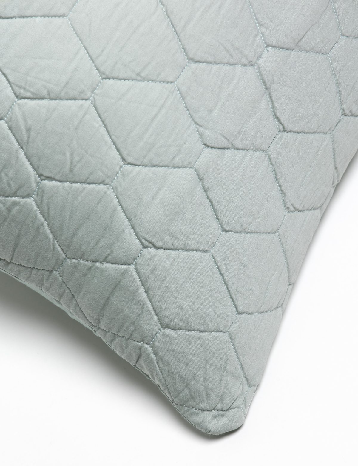 Amity home mossett quilt in seaglass featuring a distinctive hexagonal honeycomb quilting pattern with visible stitching and soft texture