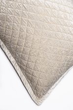 Amity home simona rayon velvet quilt   oyster colored with a soft crushed velvet texture and precise square quilting detail