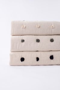 Amity home astrid quilt in natural with asphalt dots   textured tufting