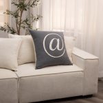 Amity home at pillow in charcoal grey   embroidered  symbol