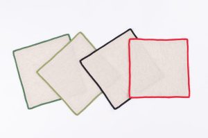 Amity home cora cocktail napkin set in natural with winter borders   piped edges