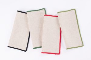 Amity home cora cocktail napkin set in natural   festive stitched borders