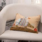 Amity home rhino pillow in tan patchwork   embroidered rhino design
