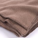 Amity home heiko super throw in camel   blanket stitch edges