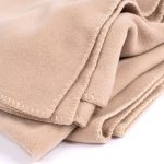 Amity home heiko throw in wheat   blanket stitching detail