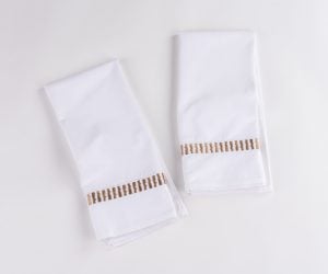 Amity home savona guest towel set in white with caramel   embroidered band