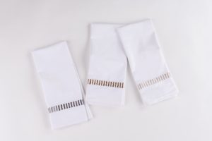 Amity home savona guest towel set in white with caramel embroidery   vertical stitched band