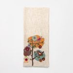 Amity home eara throw in natural   whimsical bird  tree appliqué