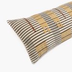 Amity home mina bolster in saddle striped   woven texture with tassels