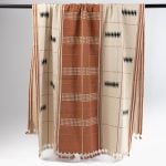 Amity home rita throw in rust   geometric woven pattern