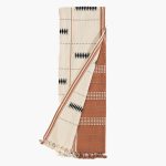 Amity home rita throw in rust  cream   geometric woven pattern