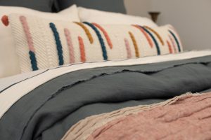 Amity home amelia bolster pillow in cream multi color   textured stripe design