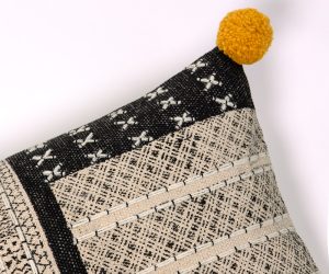 Amity home bina x long bolster in black  natural   mustard pom pom