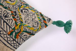 Amity home ela x long bolster in natural with embroidered pattern   teal tassel