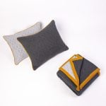 Amity home kirk knitted quilt in grey   geometric quilted pattern