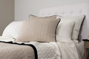 Amity home kirk knitted quilt in natural   diamond quilted with black trim