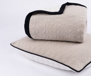 Amity home kirk knitted quilt in natural   geometric quilted pattern