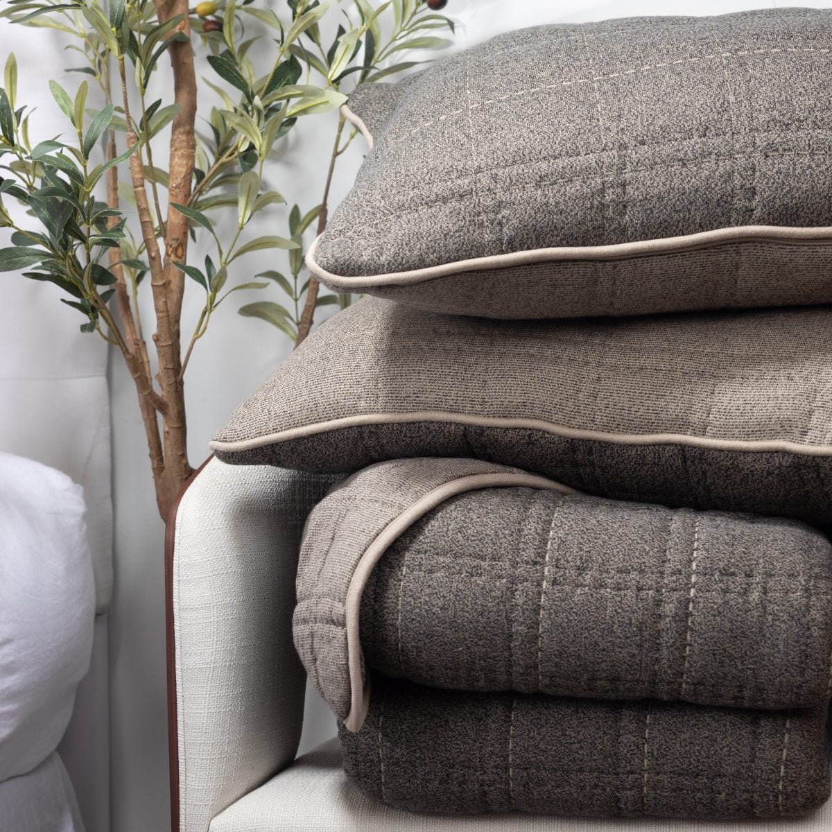 Amity home fletcher quilt in granite   textured knit with piping