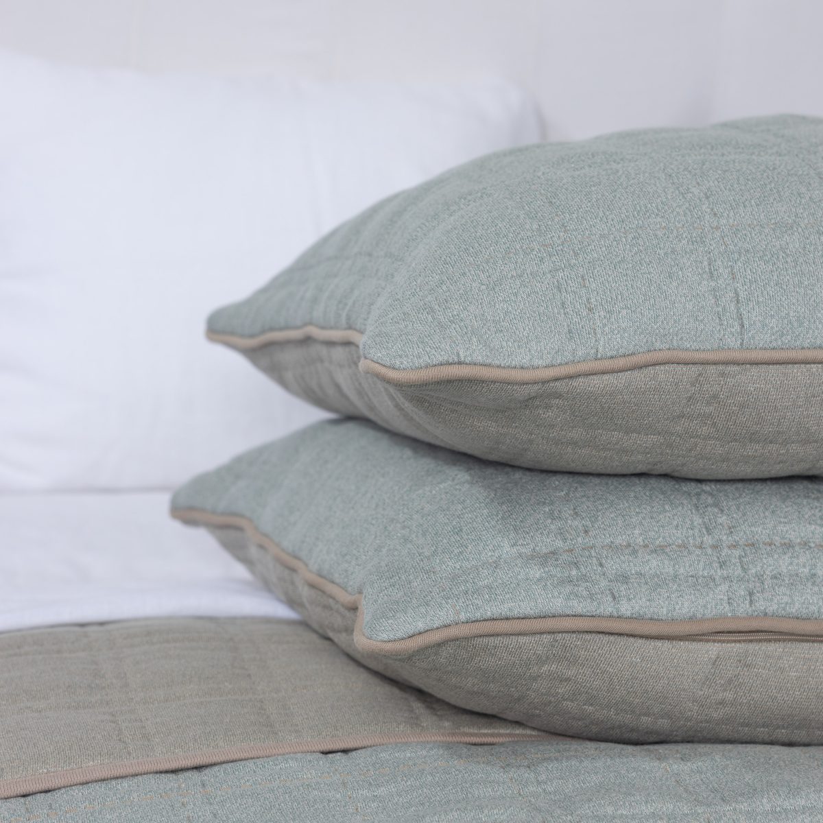 Amity home fletcher quilt in mineral   knit texture with contrast piping