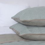 Amity home fletcher quilt in mineral   knit texture with contrast piping