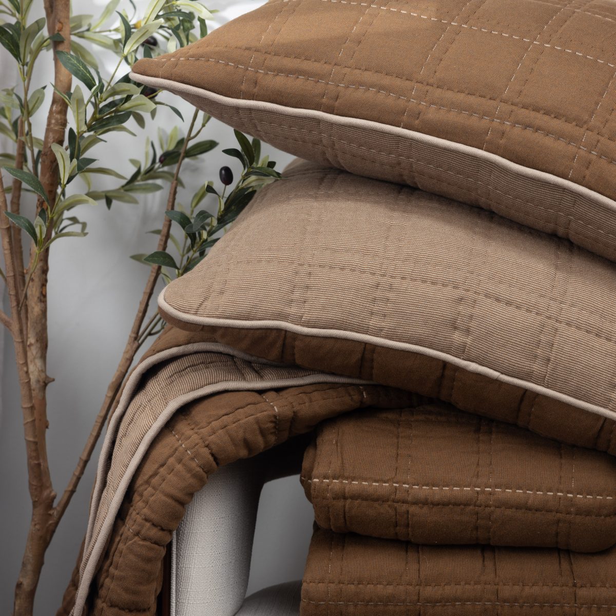 Amity home fletcher quilt in saddle   quilted grid stitching