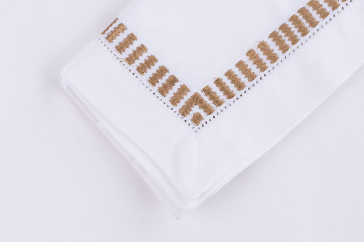 Amity home savona dinner napkin set in white   caramel ladder stitch border