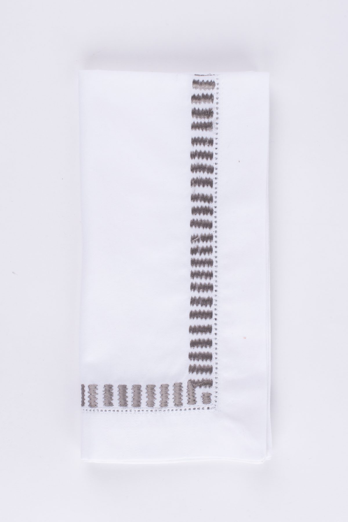 Amity home savona dinner napkin set in white with grey embroidery   geometric pattern