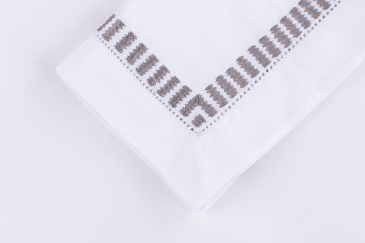 Amity home savona dinner napkin set in grey   embroidered ladder stitch border