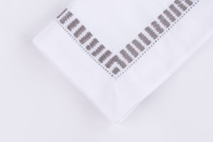 Amity home savona dinner napkin set in grey   embroidered ladder stitch border