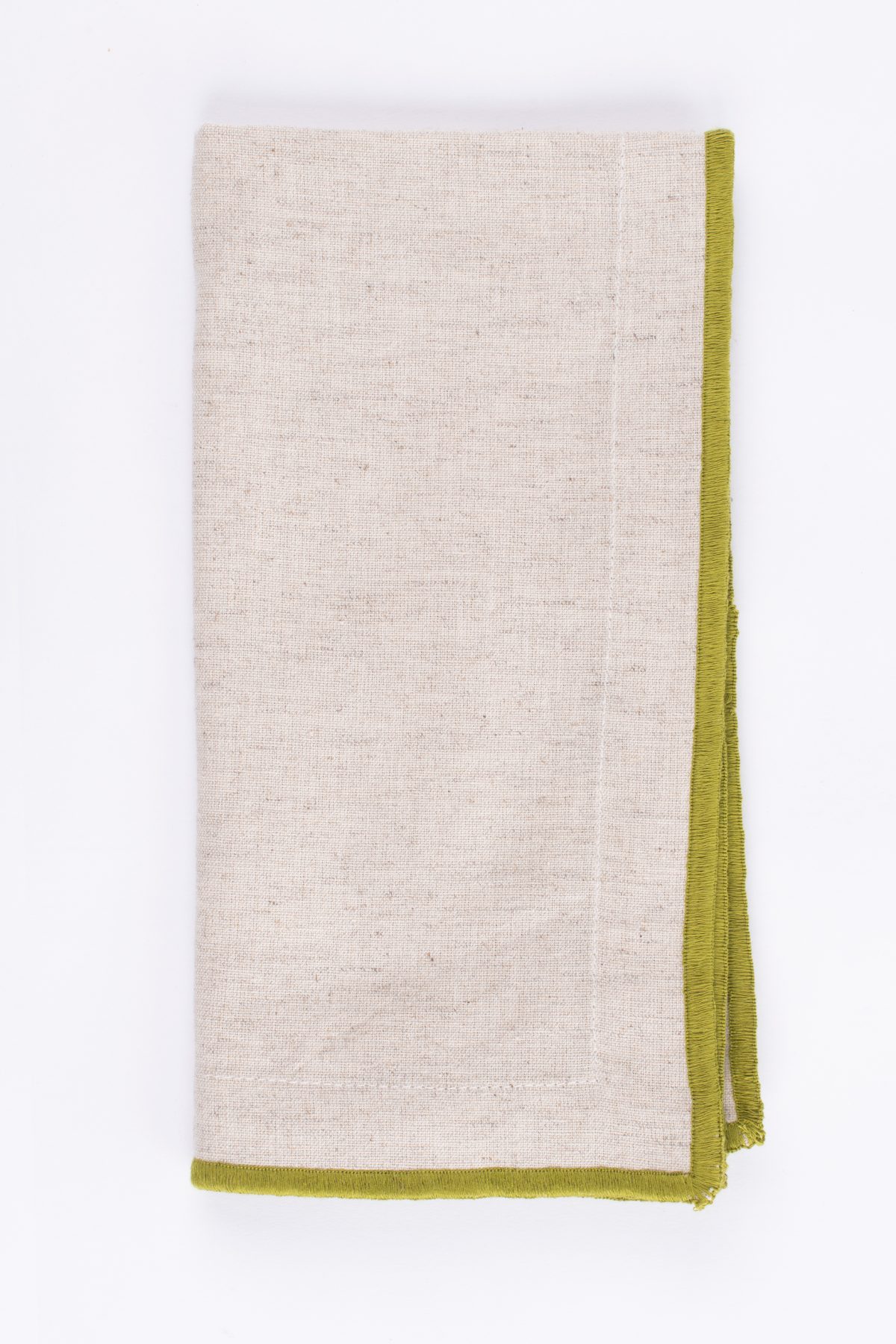 Amity home cora dinner napkin set in natural with vibrant green fringe   linen weave