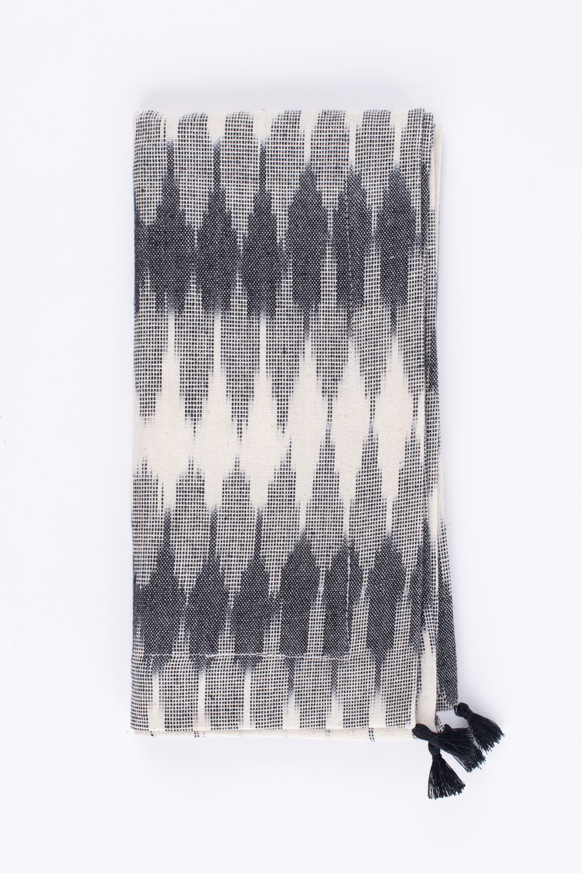 Amity home lana dinner napkin set in cream  black ikat   tasseled edge