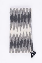 Amity home lana dinner napkin set in cream  black ikat   tasseled edge