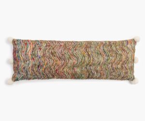 Amity home sunita x long bolster in multicolored   wavy textured weave with pom poms