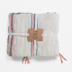 Amity home vera throw in natural with navy  coral stripes   woven texture